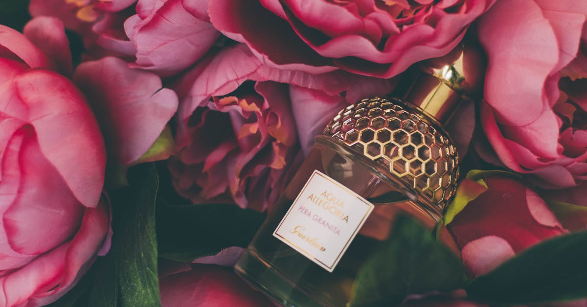 Luxurious perfume bottle nestled within vibrant pink peonies, showcasing elegance and beauty.